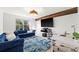 Media room with sectional sofa and workspace at 9111 Outlook Rock Trl, Windermere, FL 34786