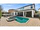 Stunning view of the backyard oasis with pool and spa at 9111 Outlook Rock Trl, Windermere, FL 34786