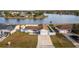 Aerial view showcasing a house's curb appeal and lake proximity at 992 Florida Pkwy, Kissimmee, FL 34743