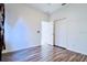 Bedroom with wood-look floors and double door closet at 12276 Alder Branch Loop, Orlando, FL 32824