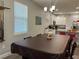 Dining room with a large table and kitchen access at 1493 Park Dr, Casselberry, FL 32707