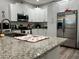 Modern kitchen with stainless steel appliances and granite countertops at 1493 Park Dr, Casselberry, FL 32707