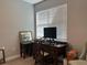 Home office with a writing desk, computer, and ample natural light from a large window at 1493 Park Dr, Casselberry, FL 32707