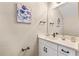 Modern powder room with white vanity and black accents at 1800 Houston St, Kissimmee, FL 34743
