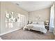 Bright bedroom with king-size bed and large windows at 1800 Houston St, Kissimmee, FL 34743
