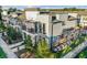 Modern townhome with gray exterior, balconies, and landscaping at 1800 Houston St, Kissimmee, FL 34743
