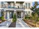 Modern two-story townhome with private balcony and landscaped grounds at 1800 Houston St, Kissimmee, FL 34743