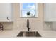 Modern kitchen sink and faucet with white countertop at 1800 Houston St, Kissimmee, FL 34743