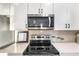 Modern kitchen with stainless steel appliances and microwave at 1800 Houston St, Kissimmee, FL 34743