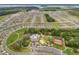 Aerial view of a community featuring a clubhouse, pool, park, and tennis courts at 1869 Brockridge Rd, Kissimmee, FL 34744