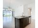 Kitchen island with granite countertop and stainless steel dishwasher at 234 Mosaic Blvd, Daytona Beach, FL 32124