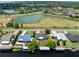 Aerial view of waterfront property with canal and lush landscaping at 2545 Harris Blvd, Kissimmee, FL 34746
