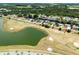 Aerial view showing home's location near golf course and canal at 2545 Harris Blvd, Kissimmee, FL 34746