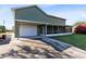 Home features a large garage and screened patio at 2545 Harris Blvd, Kissimmee, FL 34746