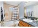 Bathroom with single sink vanity and shower/tub combo at 2545 Harris Blvd, Kissimmee, FL 34746