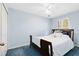 Bedroom with ceiling fan, window, and neutral color walls at 2545 Harris Blvd, Kissimmee, FL 34746