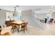Bright dining area with wooden table and access to living room at 2545 Harris Blvd, Kissimmee, FL 34746