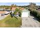 Two story home with attached garage, palm tree, and spacious green lawn at 2545 Harris Blvd, Kissimmee, FL 34746