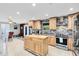 Modern kitchen with stainless steel appliances and island at 2545 Harris Blvd, Kissimmee, FL 34746
