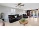 Spacious living room with leather furniture and hardwood floors at 2545 Harris Blvd, Kissimmee, FL 34746
