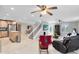 Open concept living area with kitchen and stairs at 2545 Harris Blvd, Kissimmee, FL 34746