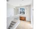 Upstairs hallway with a window and neutral decor at 2545 Harris Blvd, Kissimmee, FL 34746