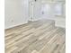 Bright living room with light wood-look vinyl flooring at 3016 Parkway Blvd # 304, Kissimmee, FL 34747