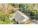 Aerial view of a house with a gray shingled roof surrounded by trees at 313 Bent Way Ln, Lake Mary, FL 32746