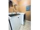 Laundry room with washer, dryer, and shelving at 3325 S Kirkman Rd # 421, Orlando, FL 32811