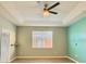 Spacious bedroom with light walls and ceiling fan at 3799 Cedar Hammock Trl, Saint Cloud, FL 34772