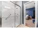 Walk-in shower with glass door and safety railing in a modern bathroom at 3907 Baja Dr, St Cloud, FL 34772