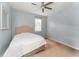 Comfortable bedroom with a queen-size bed and ceiling fan at 3907 Baja Dr, St Cloud, FL 34772