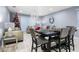 Dining area with table, chairs, and view to living room at 3907 Baja Dr, St Cloud, FL 34772