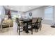 Dining area with table and chairs, adjacent to living room at 3907 Baja Dr, St Cloud, FL 34772