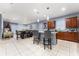 Open concept kitchen and dining area with stainless steel appliances and an island at 3907 Baja Dr, St Cloud, FL 34772