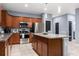 Modern kitchen featuring stainless steel appliances, ample counter space, and wood cabinets at 3907 Baja Dr, St Cloud, FL 34772