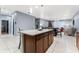 Kitchen island with granite countertop and wood cabinets at 3907 Baja Dr, St Cloud, FL 34772