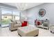 Cozy living room with sofa, ottoman, and decorative mirror at 3907 Baja Dr, St Cloud, FL 34772