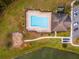 Community pool with a clubhouse, lounge chairs, and a nearby playground at 3907 Baja Dr, St Cloud, FL 34772