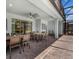 Covered patio with outdoor dining area and lounge chairs overlooking a private pool at 4141 Lana Ave, Davenport, FL 33897