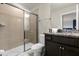 Clean and modern bathroom featuring a glass shower and granite countertop at 4141 Lana Ave, Davenport, FL 33897