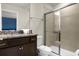 Bathroom with a walk-in shower, vanity, and granite countertop at 4141 Lana Ave, Davenport, FL 33897