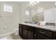 Modern bathroom featuring granite countertop, vanity, and a glass shower at 4141 Lana Ave, Davenport, FL 33897