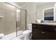 Bathroom with walk-in shower, vanity, and granite countertop at 4141 Lana Ave, Davenport, FL 33897