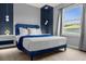 Bright and airy bedroom with blue and white decor and natural light at 4141 Lana Ave, Davenport, FL 33897