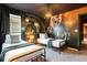 Themed bedroom featuring a Harry Potter mural and two twin beds at 4141 Lana Ave, Davenport, FL 33897