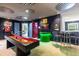 Themed game room includes shuffleboard table, Mario Kart wall art, and bar seating at 4141 Lana Ave, Davenport, FL 33897