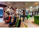 Game room with Mario Kart theme, racing chairs, foosball table, and green bar at 4141 Lana Ave, Davenport, FL 33897