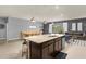 A modern kitchen with granite countertops, an island, and stainless steel appliances at 4141 Lana Ave, Davenport, FL 33897