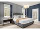 Relaxing main bedroom with a king-sized bed, plush carpeting, and an ensuite bathroom at 4141 Lana Ave, Davenport, FL 33897